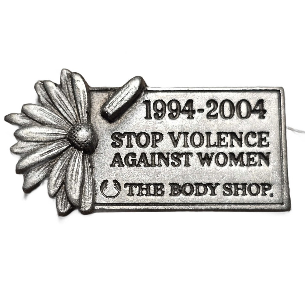 The Body Shop Stop Violence Against Women 1994-2004 lapel vest hat pin E24